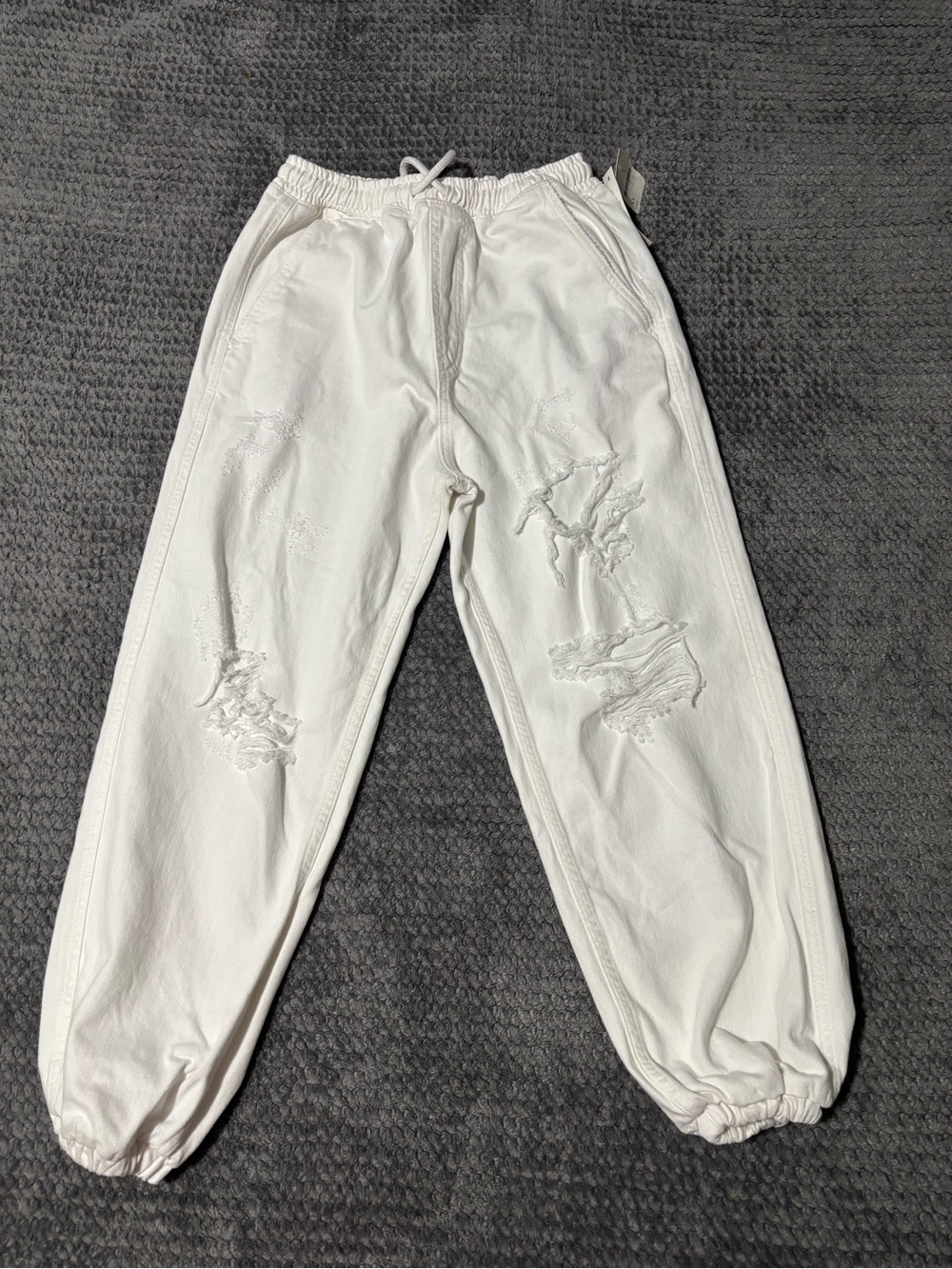 Free People white heavily distressed baggy cotton jogger pants. Size XS